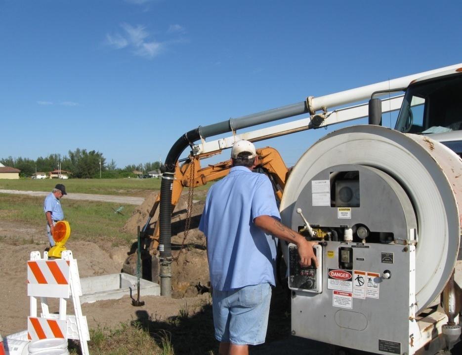 Workers using Vacuum Truck to Remove Sane and Debris from Drainage Network Pic 2